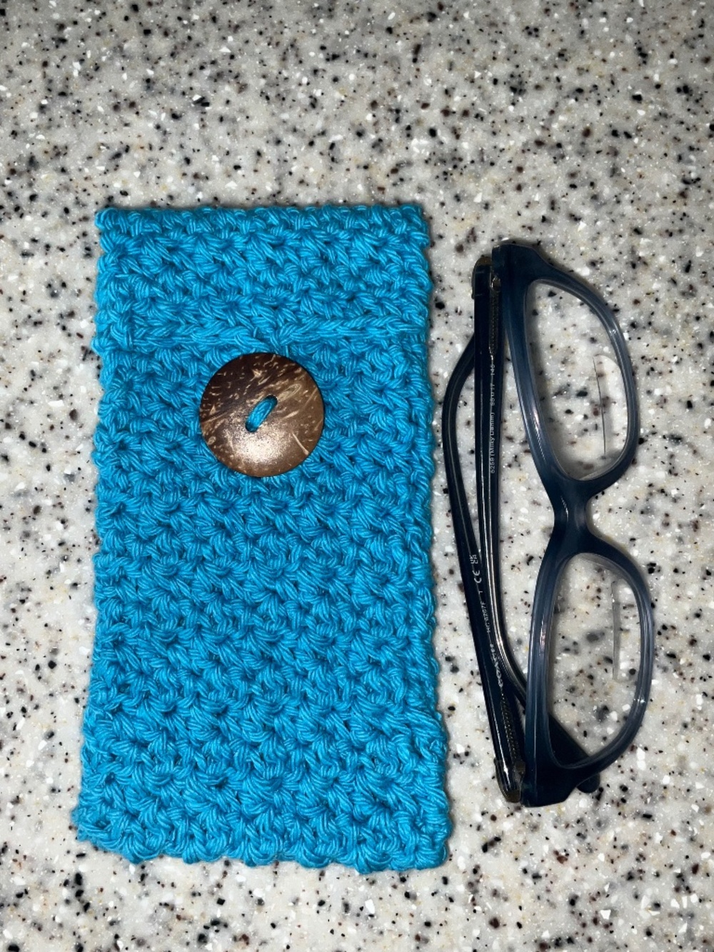 Handmade crochet eyeglass pouch/case with decorative coconut button in Blue